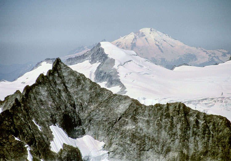 Forbidden Peak, Eldorado Peak, and Mount Baker from Mount Logan