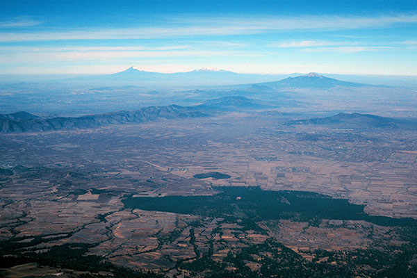 View west towards Popocatepetl, Iztaccihuatl, and La Malinche from Orizaba